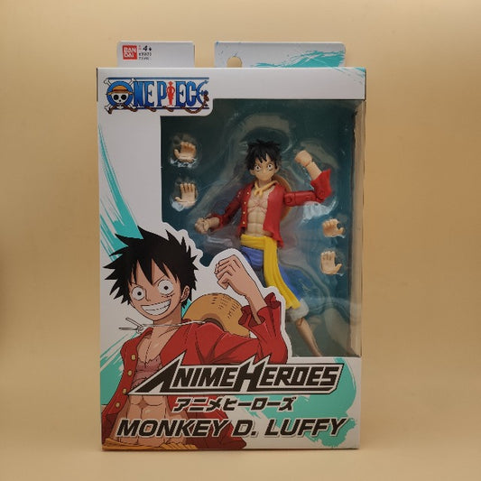 action figure luffy, persoanggio costume rosso,blu e giallo, scatola bianca e verde