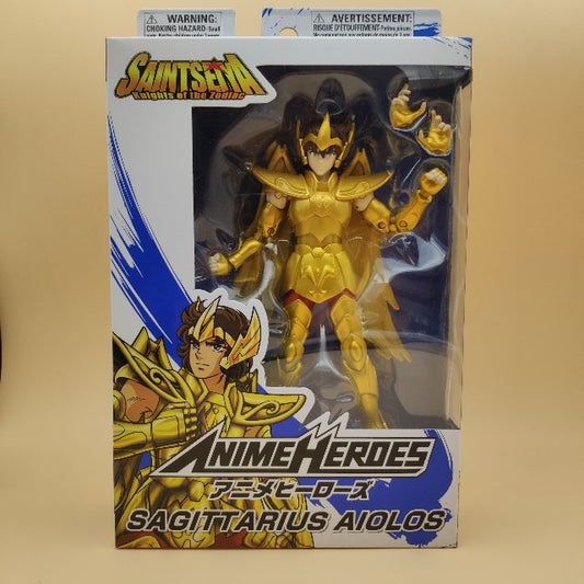 action figure sagittarius, armatura dorata,scatola blu e bianca