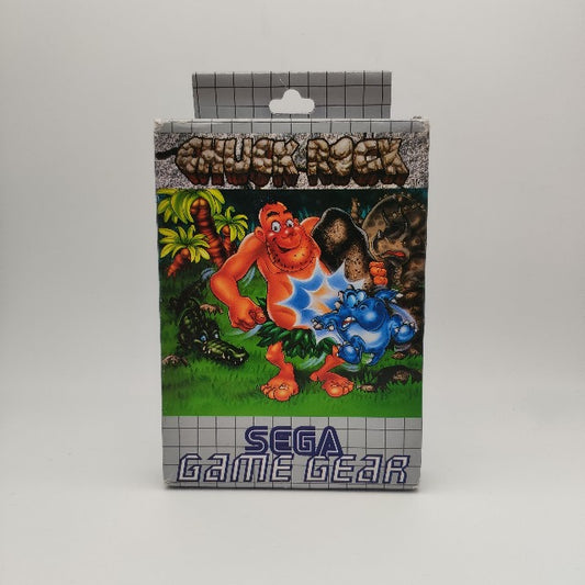 scatola grigia e blu, sfondo verde, erba,palme,cavernicolo rosa, dinosauri blu,verde,grigio