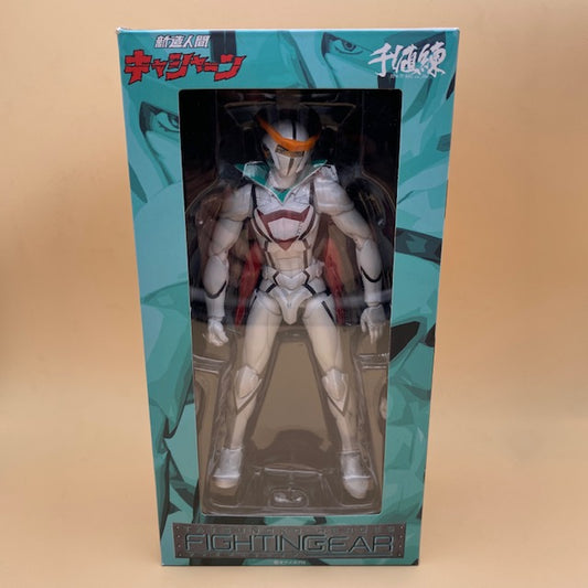 scatola color verde acqua e bianca, personaggio kyashan tuta bianca visibile