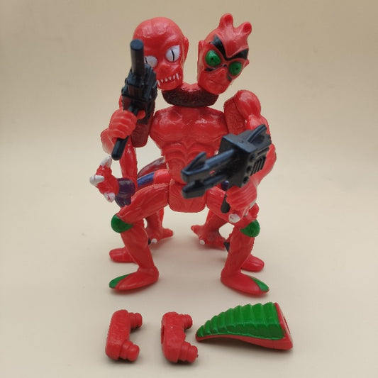 modulok personaggio masters of the universe, motu, rosso e verde , armi nere , 1984, pezzi smontabili e ricomponibili