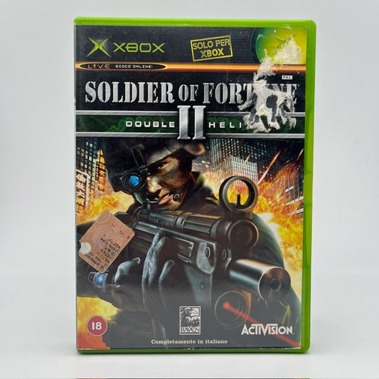 soldier of fortune 2 double helix xbox , soldato in copertina con mitra, dietro grattacieli con esplosione