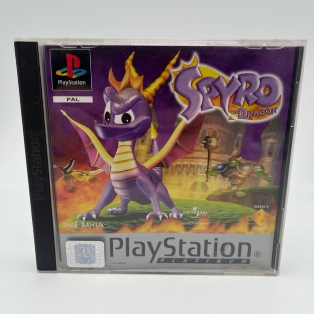 spyro the dragon ps1 , drago viola in copertina, fuoco , rovina in sfondo