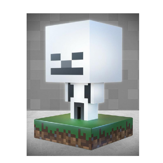 Mini lampada Paladone a forma di personaggio scheletro dal videogioco Minecraft di Mojang. Bianco con base stile terra ed erba.
