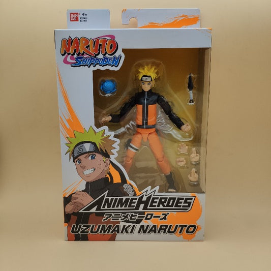 action figure naruto, persoanggio costume nero e arancione, scatola bianca ed arancione, personaggio ed accessori in vista