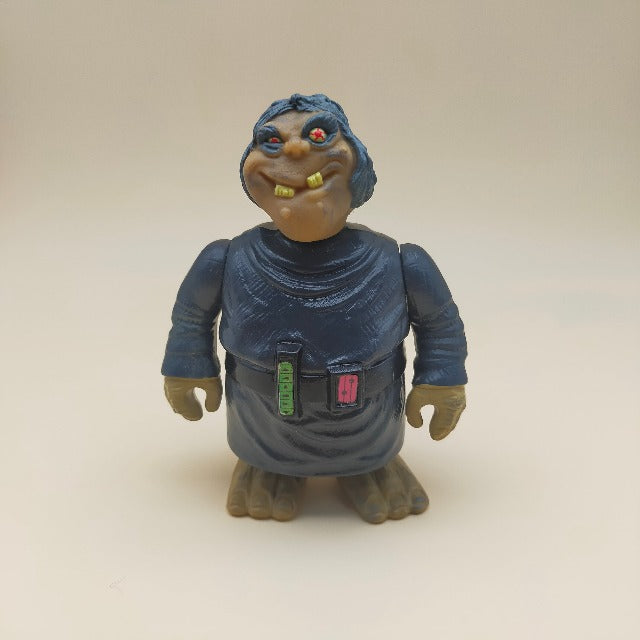 Bravestarr Outlaw Scuzz Filmation Mattel 1986, altezza 12,5 cm, personaggio con tunica grigio scuro, occhi rossie e dentoni