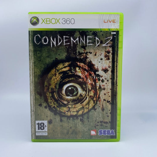 Condemned 2 X360 Xbox 360 Sega Pal Ita, parete di legno con cornice circolare ed occhio centrale tutto sporcato da schizzo di sangue