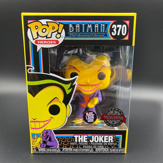 Statuina confezionata Funko Pop! del personaggio The Joker dalla serie animata di Batman. Versione Special Edition Black Light Glow.