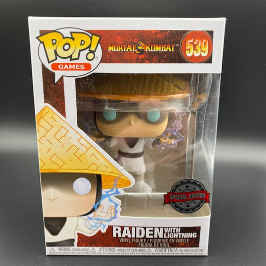 Statuina confezionata Funko Pop del personaggio Raiden con fulmini dalla serie di film e videogiochi Mortal Kombat. Versione SPecial Edition.