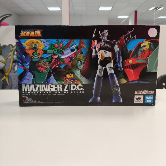 robot danneggiato, scatola con disegni mostri cartoni animati, nera, blu verde e rosso