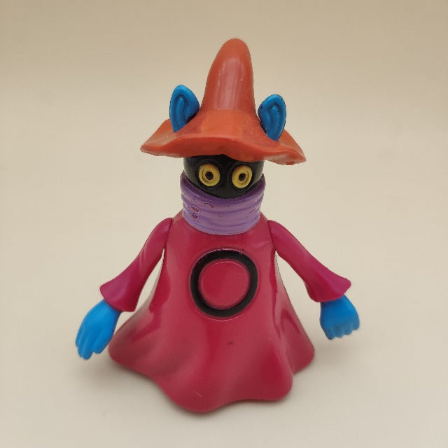 orko personaggio masters of the universe, viola , nero, blu, cappello arancione